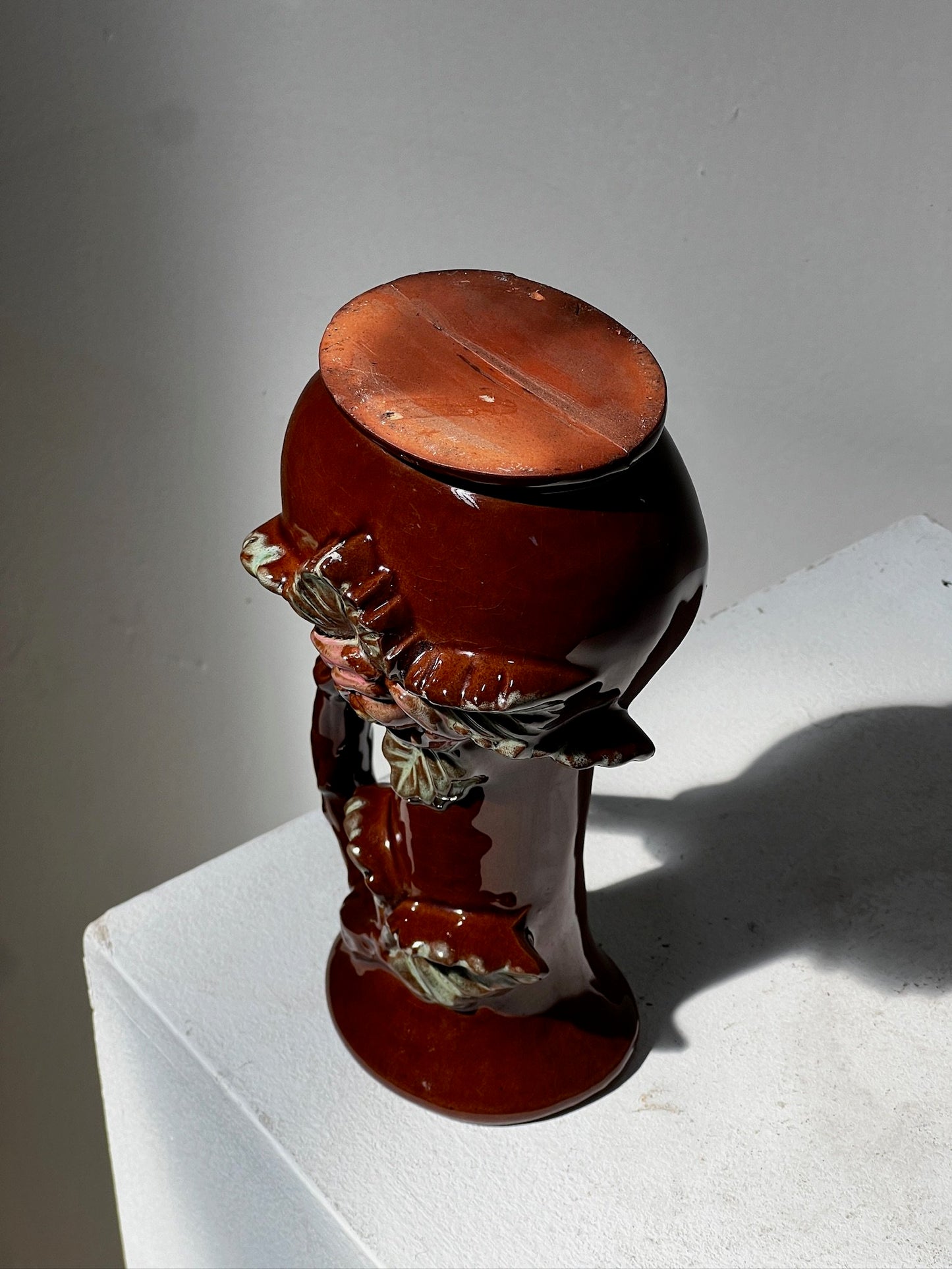 Small antique ceramic vase with 3D floral motifs