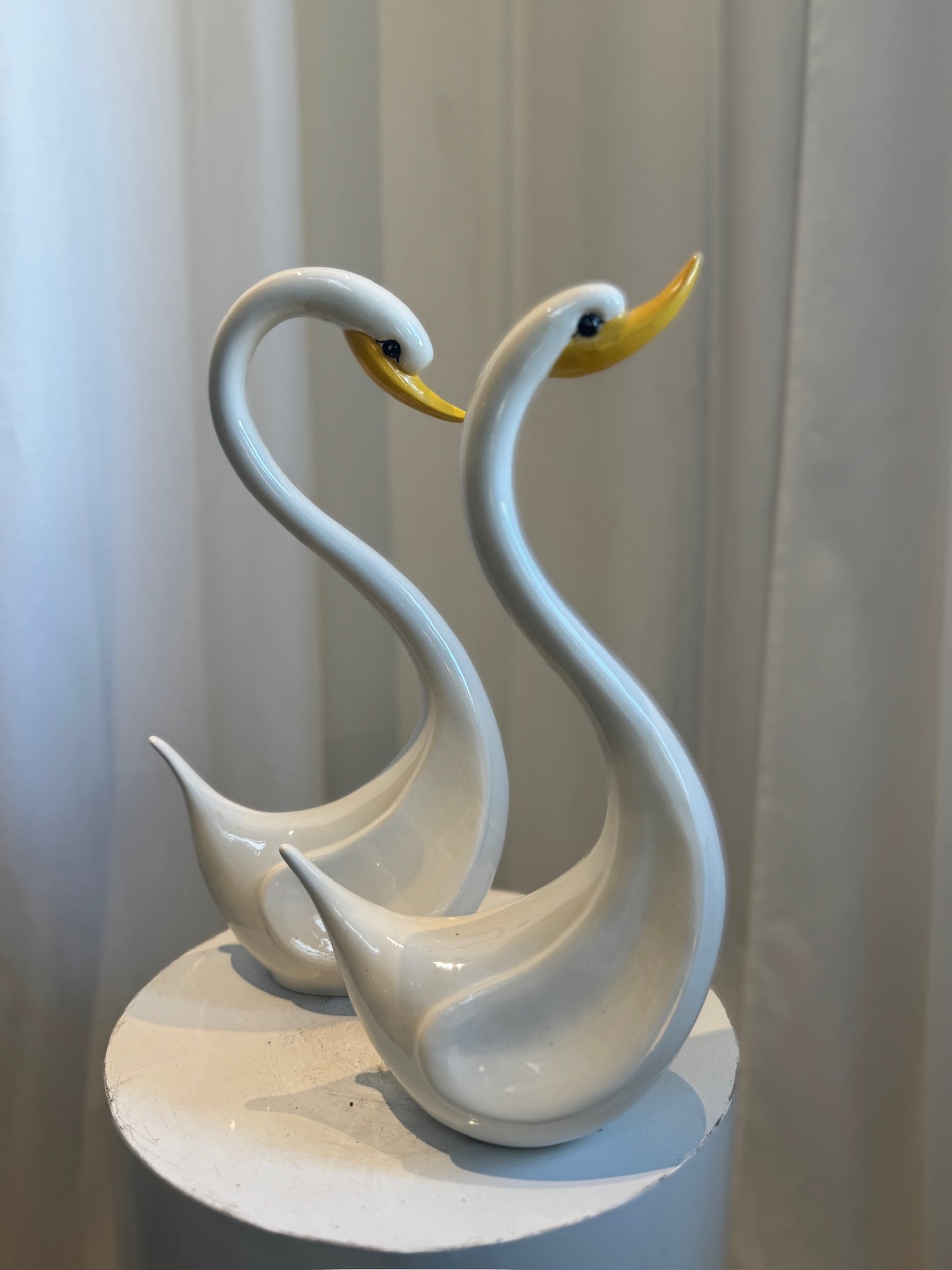 Pair of Elegant Vintage Ceramic Swan Sculptures in Gloss White with Yellow Beaks