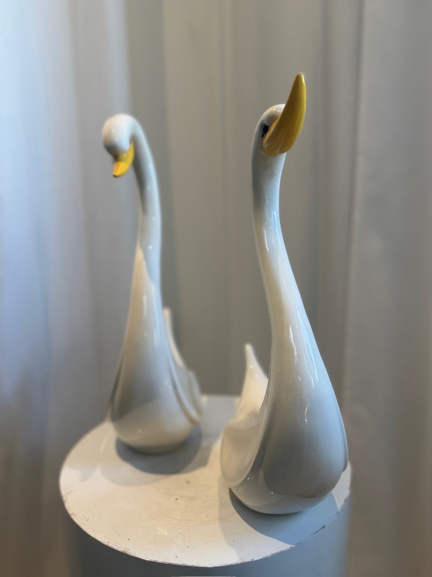 Pair of Elegant Vintage Ceramic Swan Sculptures in Gloss White with Yellow Beaks