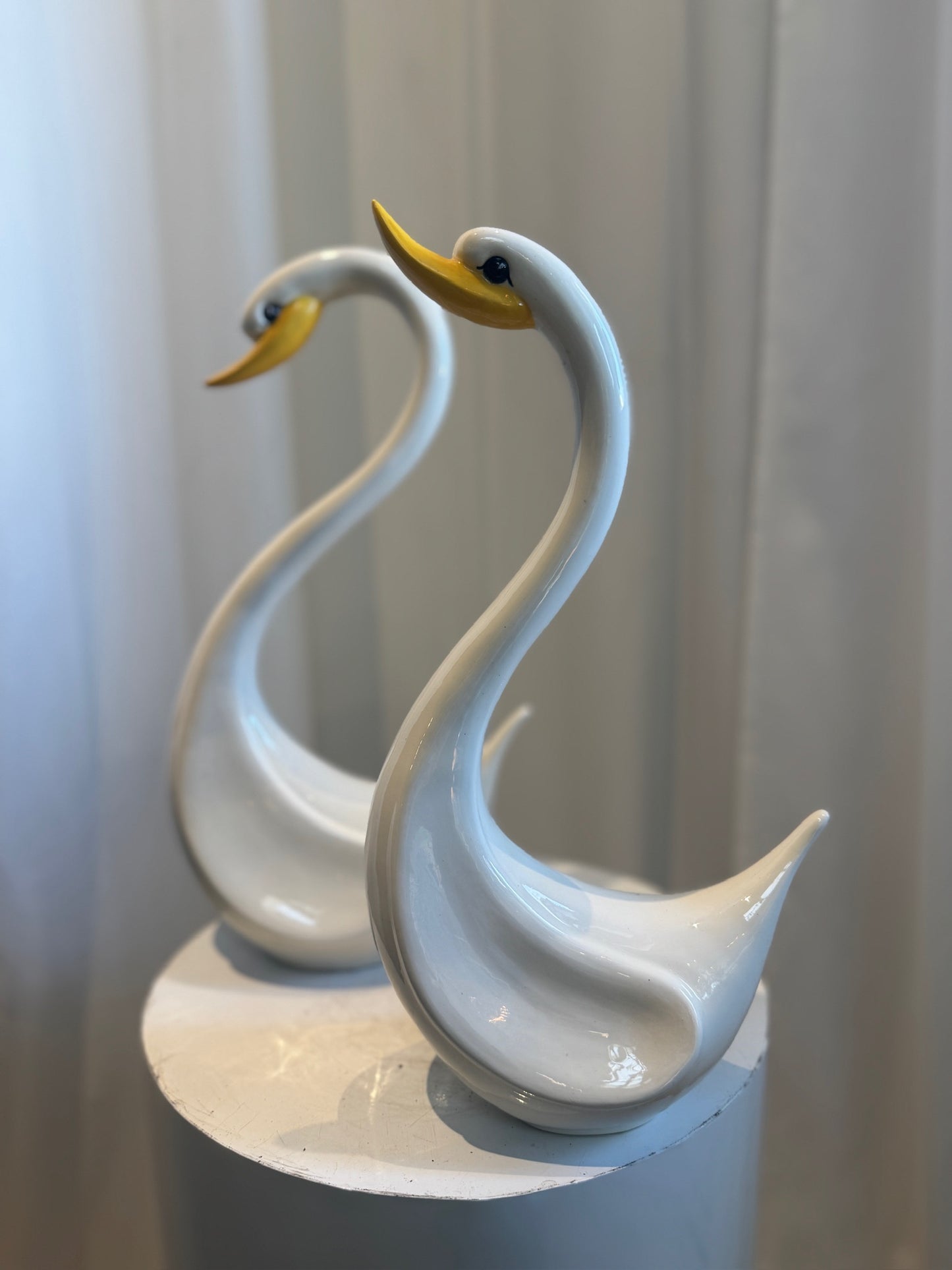 Pair of Elegant Vintage Ceramic Swan Sculptures in Gloss White with Yellow Beaks