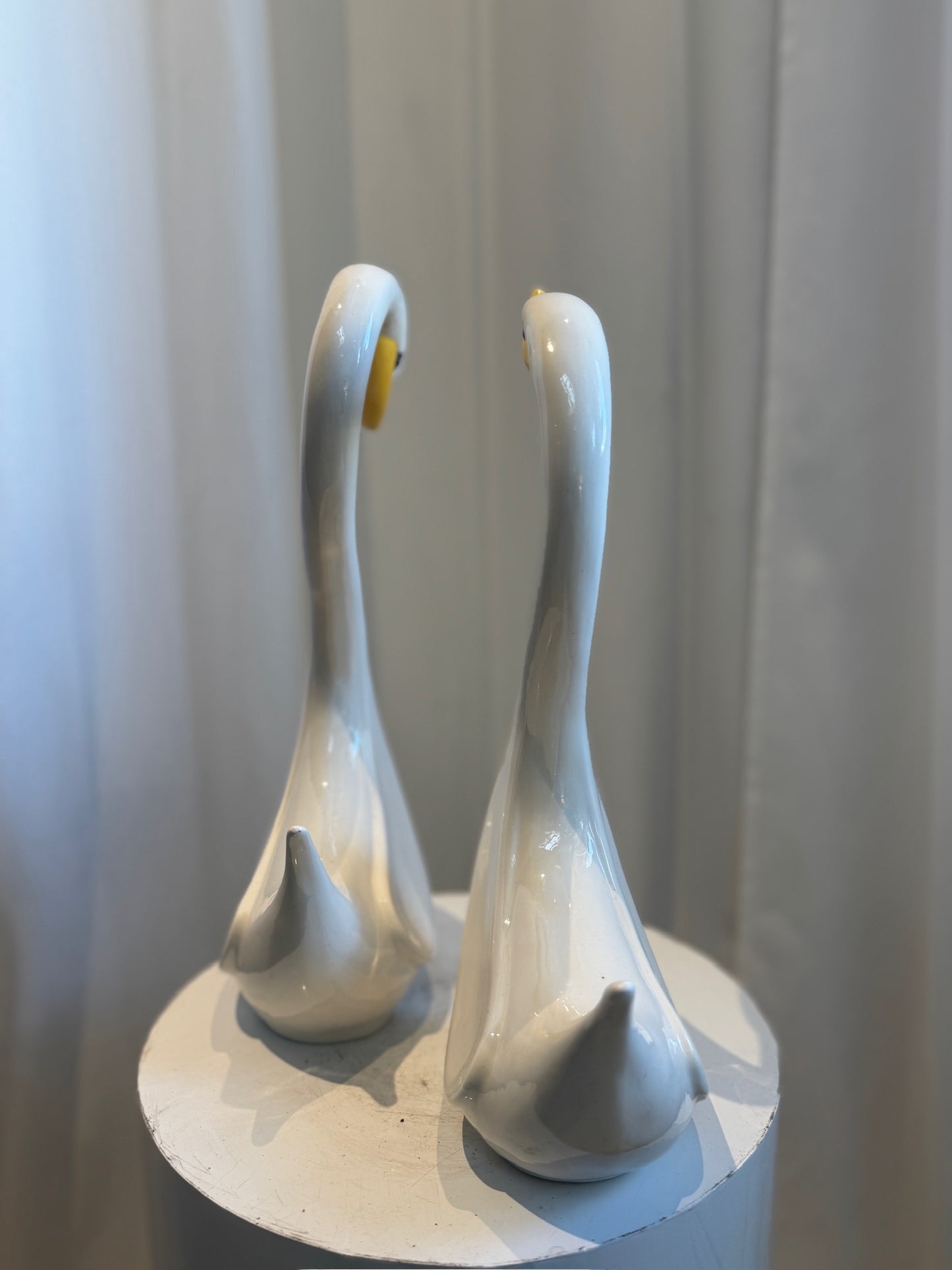 Pair of Elegant Vintage Ceramic Swan Sculptures in Gloss White with Yellow Beaks