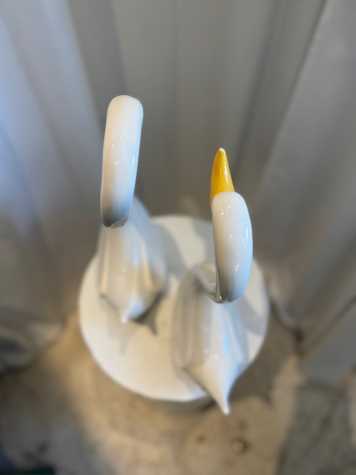 Pair of Elegant Vintage Ceramic Swan Sculptures in Gloss White with Yellow Beaks