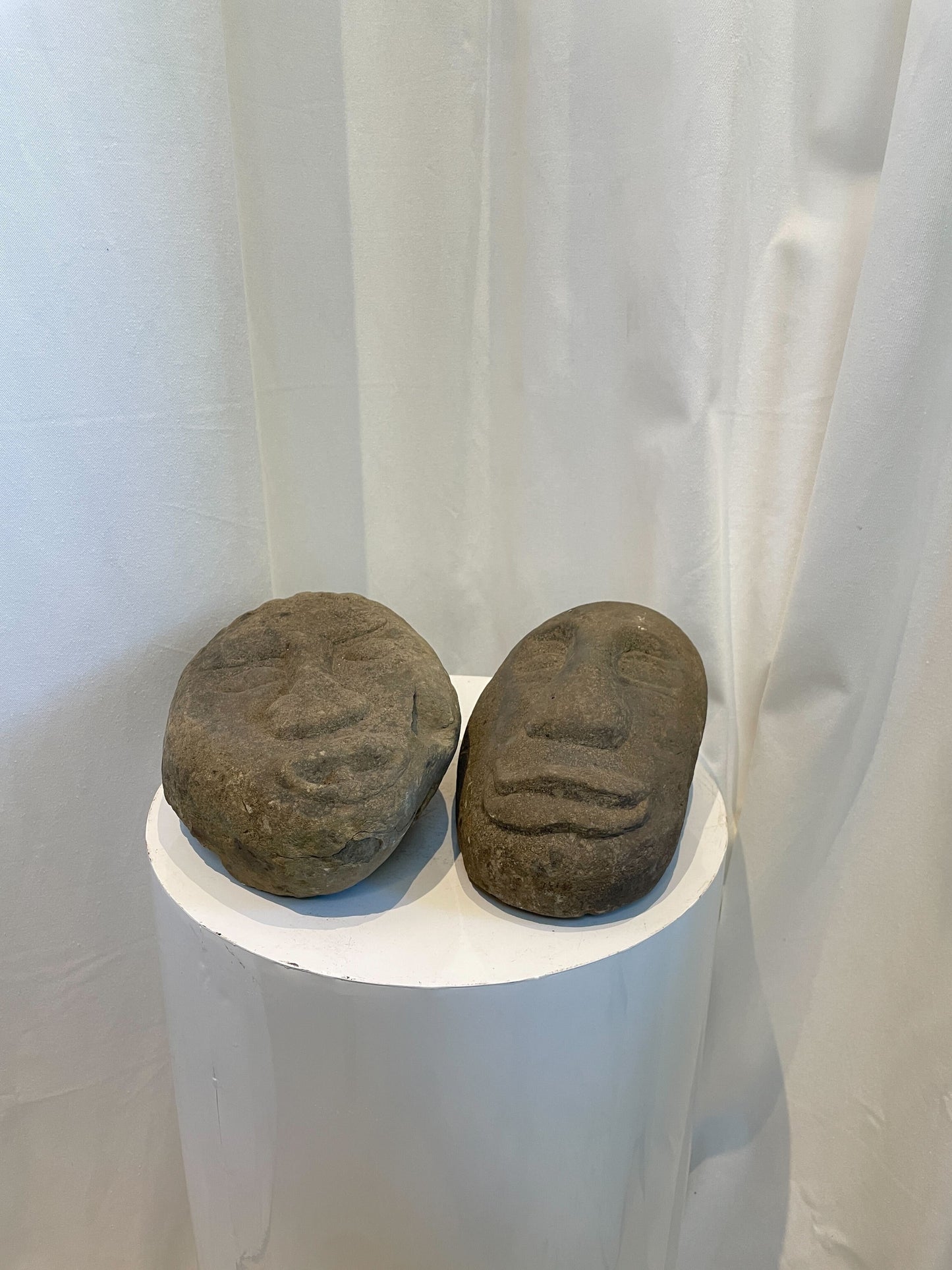 Pair of Hand-Carved Stone Tribal Face Sculptures – Primitive Art