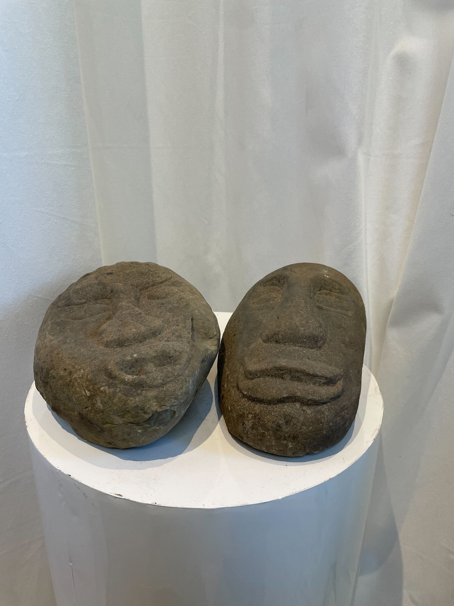 Pair of Hand-Carved Stone Tribal Face Sculptures – Primitive Art