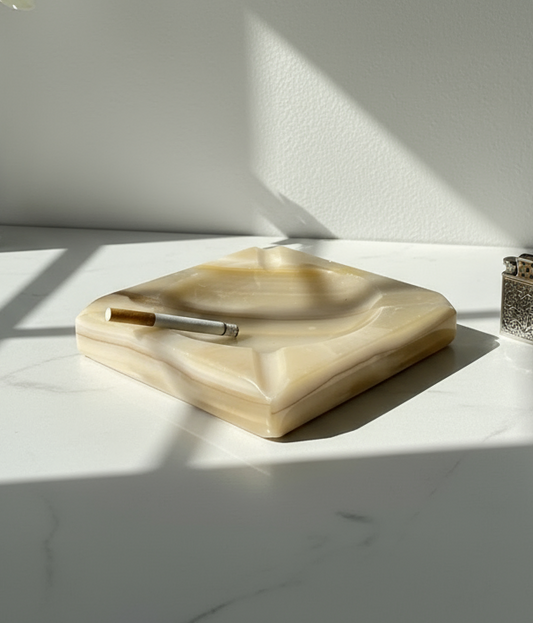1960s cream-coloured stone ashtray with clean geometric lines, four cigarette rests, and polished finish, a timeless mid-century collectible — Hommes and Gardens, Smoke + Fire Collection, Decorative Objects, Landscape Architect, Interior Designer, Outdoor Living, Outdoor Decorations, Home Design, Luxury Design, Art, Furniture, Objects, Best Gifts, Nature, Backyard, Yard.