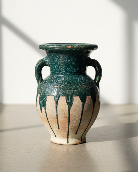 Alt text: Vintage glazed terracotta amphora vase with drip glaze detailing in green and earth tones — Hommes and Gardens, Mediterranean Collection, landscape design, plant design, Landscape Architect, Interior Designer, Outdoor Living, Outdoor Decorations, Home Design, Luxury Design, Art, Furniture, Objects, Best Gifts, Nature, Backyard, Yard.