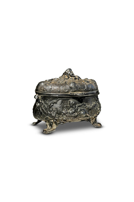 Antique 19th-century French metal jewelry box with intricate cherub and bird motifs, an ornate decorative object reflecting classic French craftsmanship — Hommes and Gardens, Decorative Collection, Home Decor, Landscape Architect, Interior Designer, Outdoor Living, Outdoor Decorations, Home Design, Luxury Design, Art, Furniture, Objects, Best Gifts, Nature, Backyard, Yard.