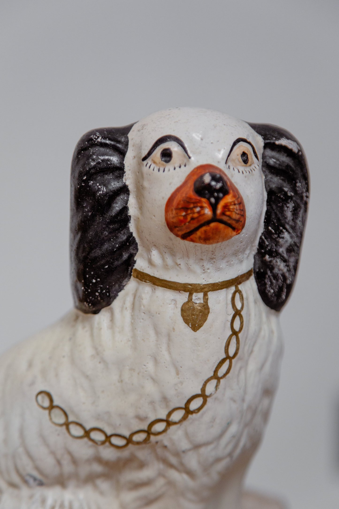 Antique Victorian Staffordshire dog figurines handcrafted in England, detailed ceramic artistry showcasing historical 19th-century charm — Hommes and Gardens, Home Decor Collection, Figurines, Antique Decor, Victorian Pottery, Heritage Collectibles, English Ceramic Art, Vintage Home Accent.