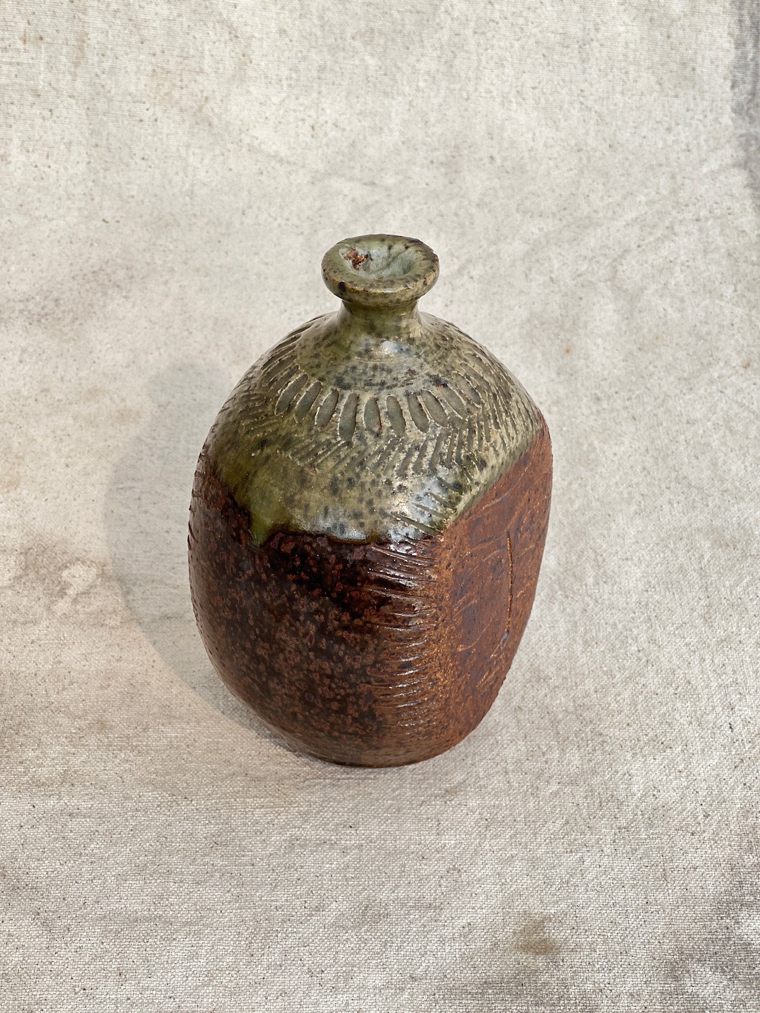 Artistic ceramic vase with engraved face design by E. Harris, a beautiful stoneware pottery collectible — Hommes and Gardens, Vases + Vessels Collection, home decor, outdoor decorations, home design, luxury design, Landscape Architect, Interior Designer, Outdoor Living, Art, Furniture, Objects, Best Gifts, Nature, Backyard, Yard.