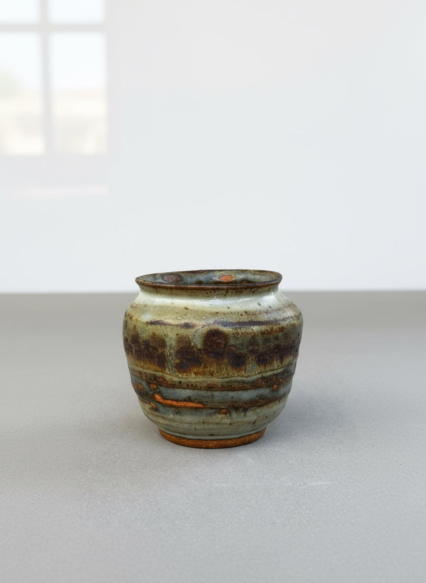 Studio pottery ceramic urn vase signed P.S.E. featuring brown, gray, and terracotta ash glaze with natural textured finish — Hommes and Gardens, Home Decor Collection, landscape design, plant design, Landscape Architect, Interior Designer, Outdoor Living, Outdoor Decorations, Home Design, Luxury Design, Art, Furniture, Objects, Best Gifts, Nature, Backyard, Yard.