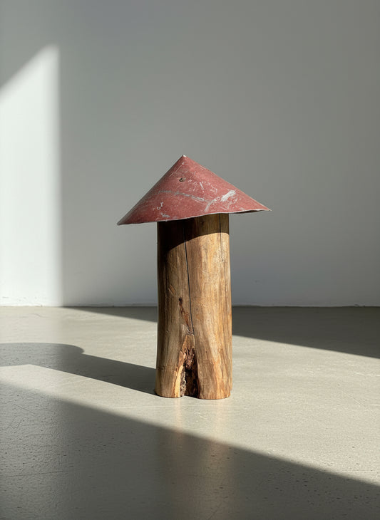 Cone-roof mushroom sculpture handcrafted from weathered wood with a tall red metal top, expressing rustic primitive folk art style and reclaimed craftsmanship — Hommes and Gardens, Home Decor Collection, landscape design, plant design, Landscape Architect, Interior Designer, Outdoor Living, Outdoor Decorations, Home Design, Luxury Design, Art, Furniture, Objects, Best Gifts, Nature, Backyard, Yard.