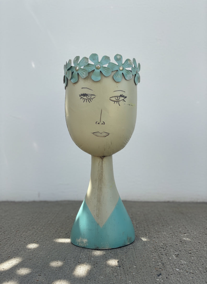 Whimsical mid-century modern metal female bust planter with aqua floral crown and hand-painted folk art details — Hommes and Gardens, Home Decor Collection, landscape design, plant design, Landscape Architect, Interior Designer, Outdoor Living, Outdoor Decorations, Home Design, Luxury Design, Art, Furniture, Objects, Best Gifts, Nature, Backyard, Yard.