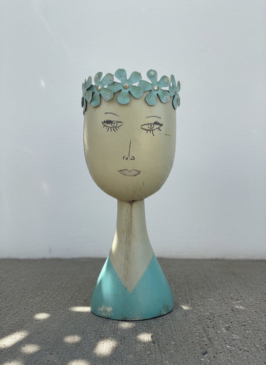 Whimsical mid-century modern metal female bust planter with aqua floral crown and hand-painted folk art details — Hommes and Gardens, Home Decor Collection, landscape design, plant design, Landscape Architect, Interior Designer, Outdoor Living, Outdoor Decorations, Home Design, Luxury Design, Art, Furniture, Objects, Best Gifts, Nature, Backyard, Yard.