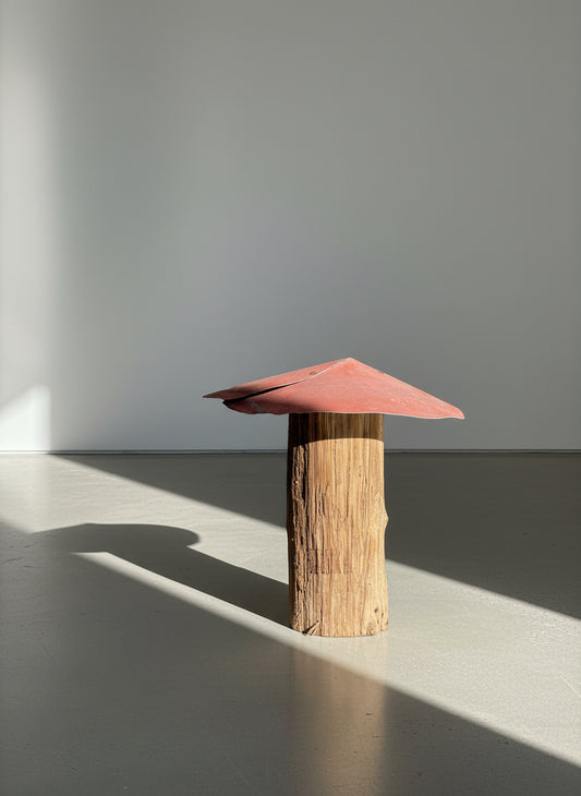 Flat red-roof mushroom sculpture handcrafted from weathered wood with a simple angled metal top, showcasing rustic primitive folk art design and reclaimed handmade charm — Hommes and Gardens, Home Decor Collection, landscape design, plant design, Landscape Architect, Interior Designer, Outdoor Living, Outdoor Decorations, Home Design, Luxury Design, Art, Furniture, Objects, Best Gifts, Nature, Backyard, Yard.