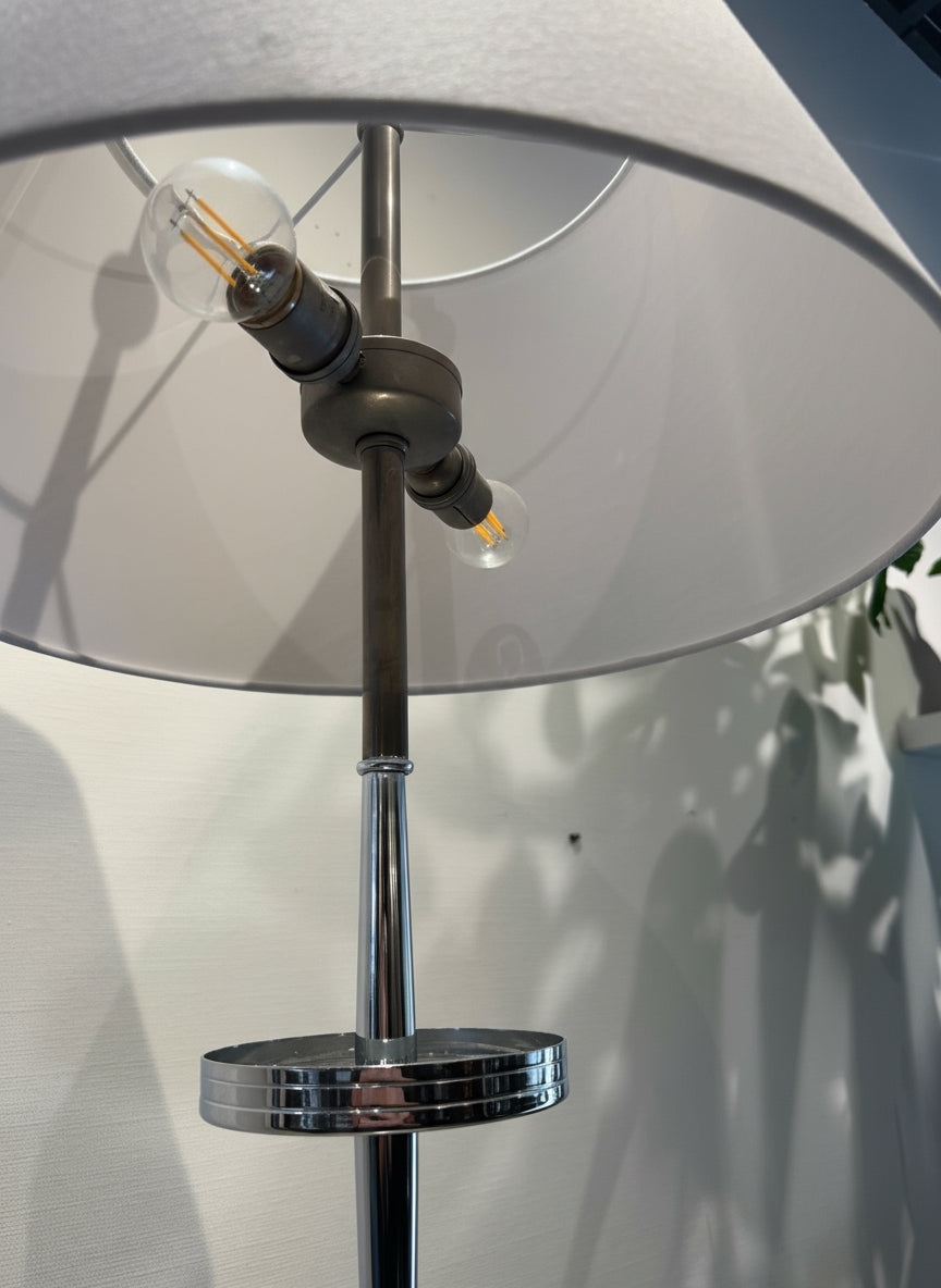 Side view of vintage Global Views stainless steel floor lamp showing three-tier tray shelves and sleek modern frame — Hommes and Gardens, Home Decor Collection, Lighting, landscape design, plant design, Landscape Architect, Interior Designer, Outdoor Living, Outdoor Decorations, Home Design, Luxury Design, Art, Furniture, Objects, Best Gifts, Nature, Backyard, Yard.