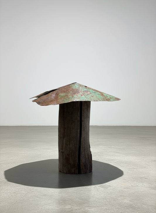Green-patina mushroom sculpture handcrafted from a weathered log stem with an aged metal cap, showcasing rustic primitive folk art and reclaimed garden design — Hommes and Gardens, Home Decor Collection, landscape design, plant design, Landscape Architect, Interior Designer, Outdoor Living, Outdoor Decorations, Home Design, Luxury Design, Art, Furniture, Objects, Best Gifts, Nature, Backyard, Yard.