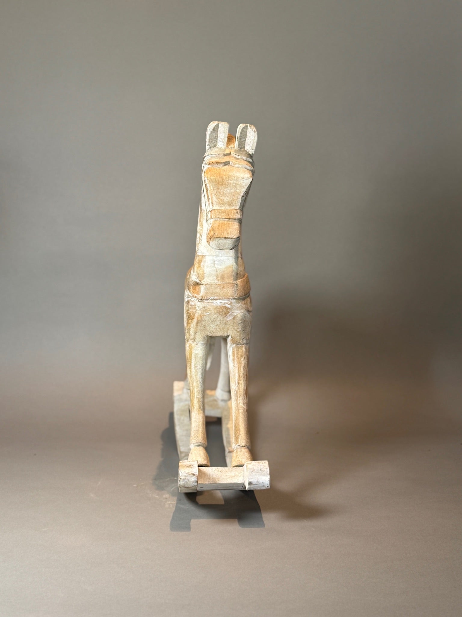 Antique hand-carved wooden rocking horse, small 15.5-inch size with folk art styling and whitewashed aged finish, close-up — Hommes and Gardens, Home Decor Collection, landscape design, plant design, Landscape Architect, Interior Designer, Outdoor Living, Outdoor Decorations, Home Design, Luxury Design, Art, Furniture, Objects, Best Gifts, Nature, Backyard, Yard.
