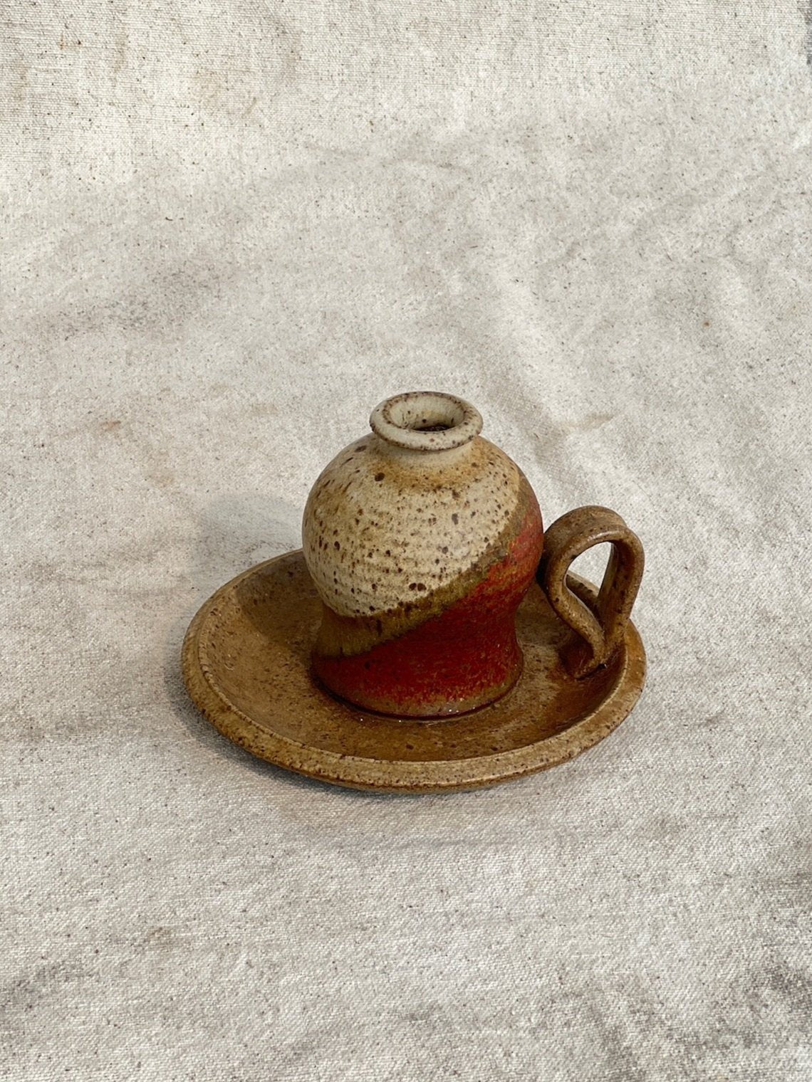 Handcrafted vintage stoneware chamber stick candle holder in warm brown glaze, perfect for cozy and rustic home interiors — Hommes and Gardens, Home Decor Collection, Candles, Vintage Pottery, Ceramic Candle Holder, Rustic Decor, Handmade Home Accent, Classic Ceramic Art.