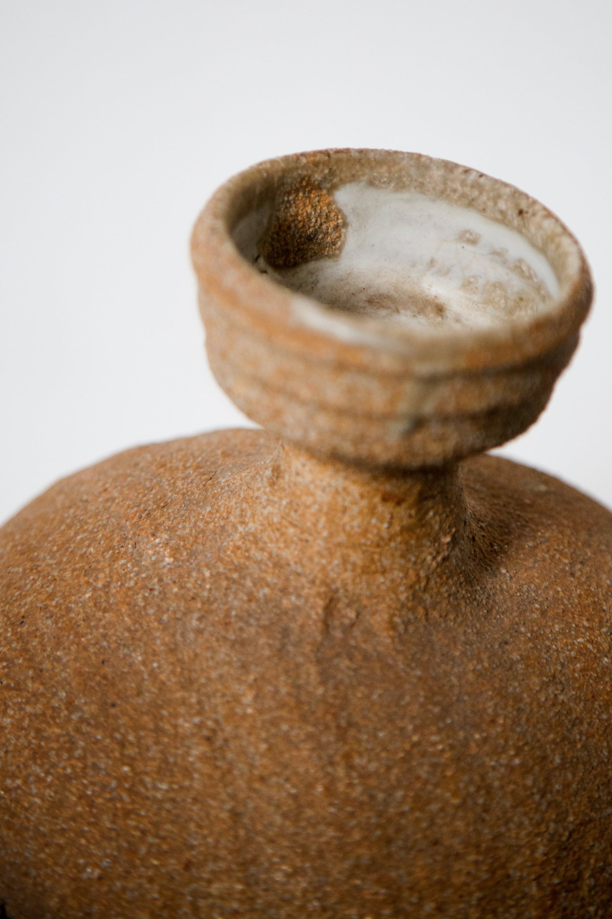 Handcrafted vintage unglazed ceramic face water dispenser, artistic sculptural pottery combining form and utility — Hommes and Gardens, Home Decor Collection, Water Dispensers, Ceramic Art, Vintage Decor, Handmade Pottery, Artistic Sculpture, Functional Home Accent.