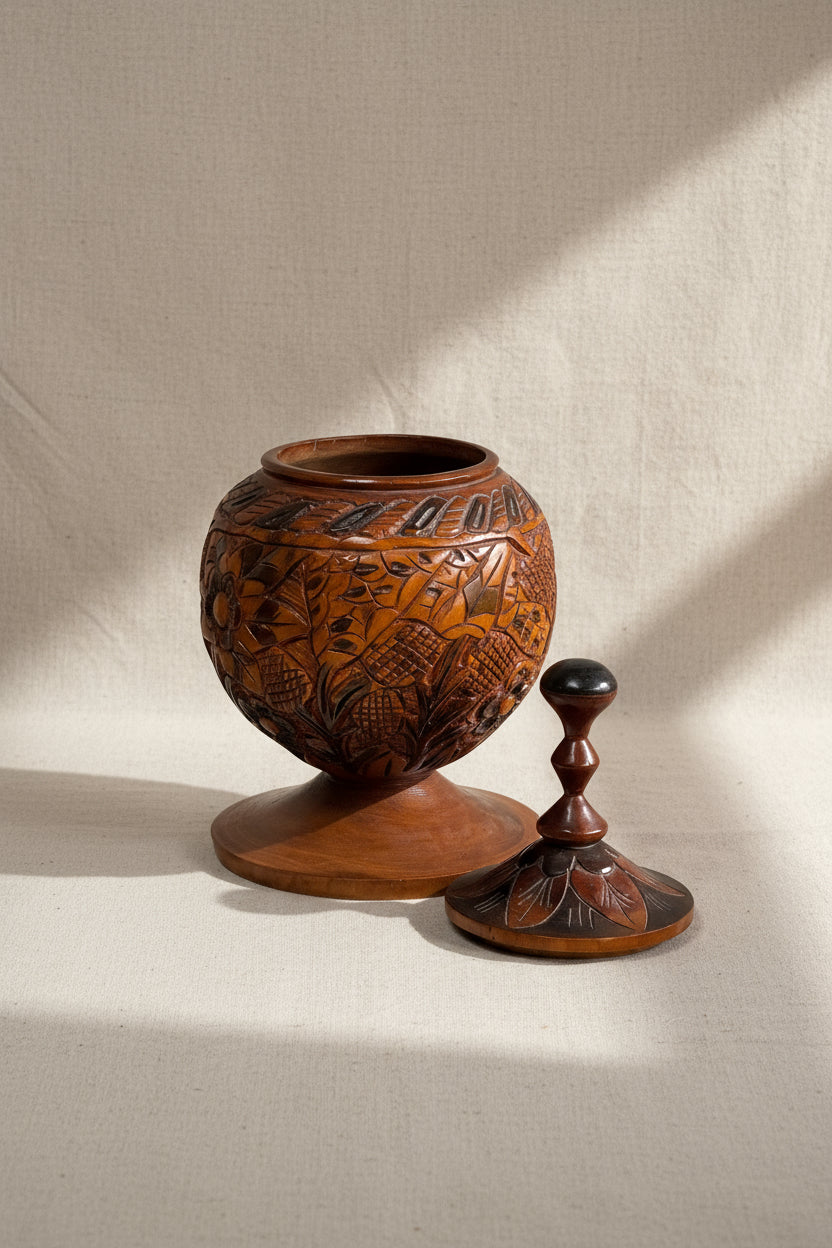 Handcrafted vintage wooden lidded vessel in Arts and Crafts style, showcasing intricate carvings and historical elegance — Hommes and Gardens, Pots + Vessels Collection, Vases, Vintage Decor, Wooden Craft, Handmade Sculpture, Rustic Home Accent, Artisan Heritage Object.