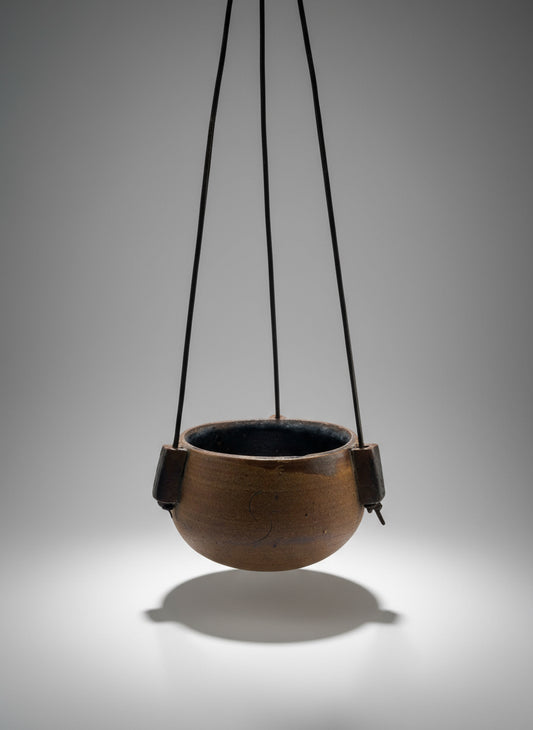 1972 Karroll Studio Pottery hanging planter in speckled stoneware with leather cords and earthy glaze — Hommes and Gardens, Pots + Vessels Collection, landscape design, plant design, Landscape Architect, Interior Designer, Outdoor Living, Outdoor Decorations, Home Design, Luxury Design, Art, Furniture, Objects, Best Gifts, Nature, Backyard, Yard.