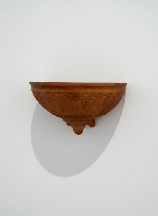 Vintage Italian terracotta wall pocket planter with handcrafted fluted design and natural weathered patina, front view — Hommes and Gardens, Pots + Vessels Collection, landscape design, plant design, Landscape Architect, Interior Designer, Outdoor Living, Outdoor Decorations, Home Design, Luxury Design, Art, Furniture, Objects, Best Gifts, Nature, Backyard, Yard.
