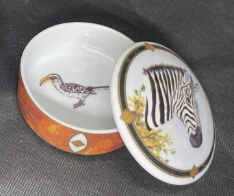 Lynn Chase hand-painted jewelry box featuring zebra motif on lid and Karat bird inside, artisanal trinket box blending wilderness and elegance — Hommes and Gardens, Decorative Collection, Landscape Architect, Interior Designer, Outdoor Living, Outdoor Decorations, Home Decor, Home Design, Luxury Design, Art, Furniture, Objects, Best Gifts, Nature, Backyard, Yard.