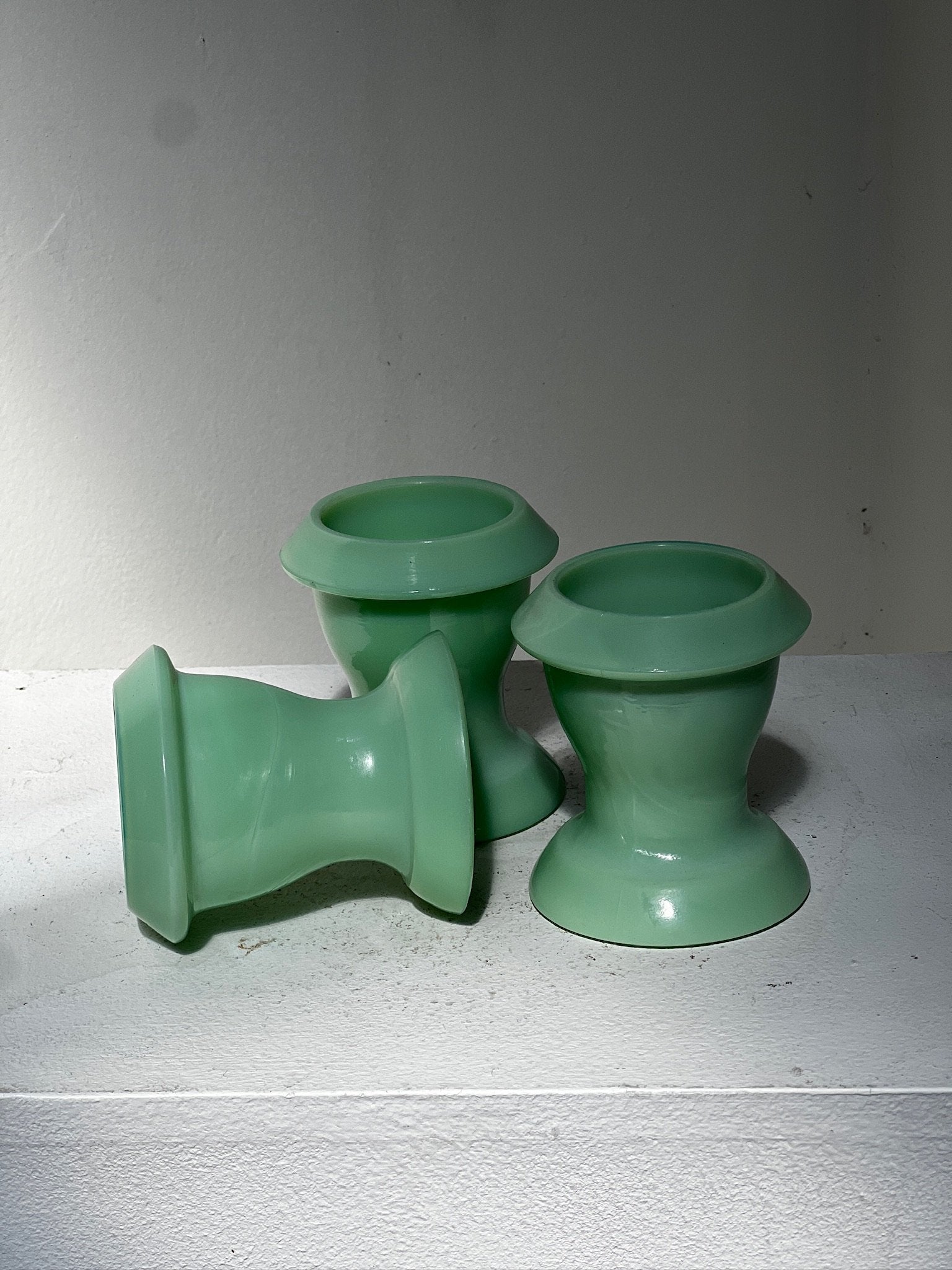Mid-century jadeite egg cup set in teal glass, a trio of vintage collectibles perfect for adding color and character to dining or kitchen displays — Hommes and Gardens, Home Decor Collection, Bowls, Decorative Objects, Vintage Kitchenware, Retro Table Accessories, Jadeite Glassware, Collectible Dining Decor.
