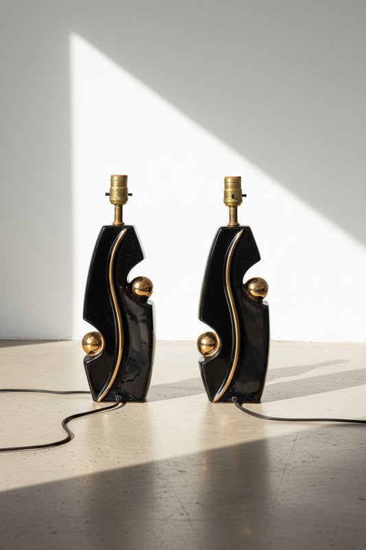 Pair of mid-century modern glazed pottery table lamps in black and gold inspired by Picasso’s artistic style, perfect for elegant interiors — Hommes and Gardens, Lighting Collection, Home Decor, Vintage Lamps, Designer Lighting, Modern Art Style, Luxury Interior Design.
