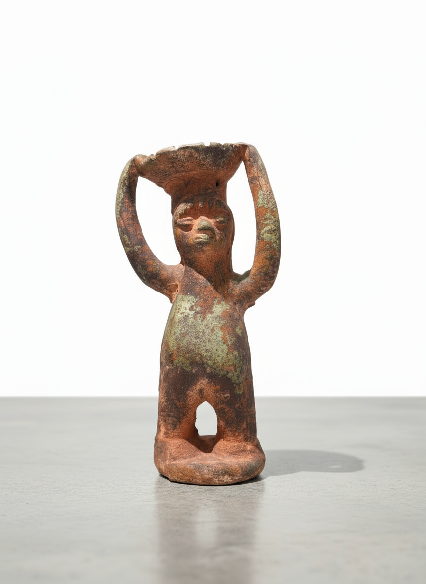 Pre-Columbian terracotta ritual figure with raised arms holding a bowl, front view showing green patina and hollow base — Hommes and Gardens, Home Decor, landscape design, plant design, Landscape Architect, Interior Designer, Outdoor Living, Outdoor Decorations, Home Design, Luxury Design, Art, Furniture, Objects, Best Gifts, Nature, Backyard, Yard.