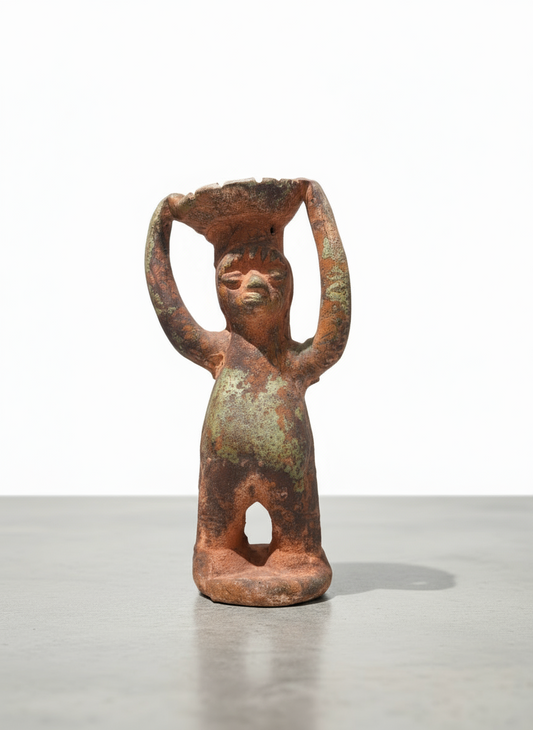 Pre-Columbian terracotta ritual figure with raised arms holding a bowl, front view showing green patina and hollow base — Hommes and Gardens, Home Decor, landscape design, plant design, Landscape Architect, Interior Designer, Outdoor Living, Outdoor Decorations, Home Design, Luxury Design, Art, Furniture, Objects, Best Gifts, Nature, Backyard, Yard.