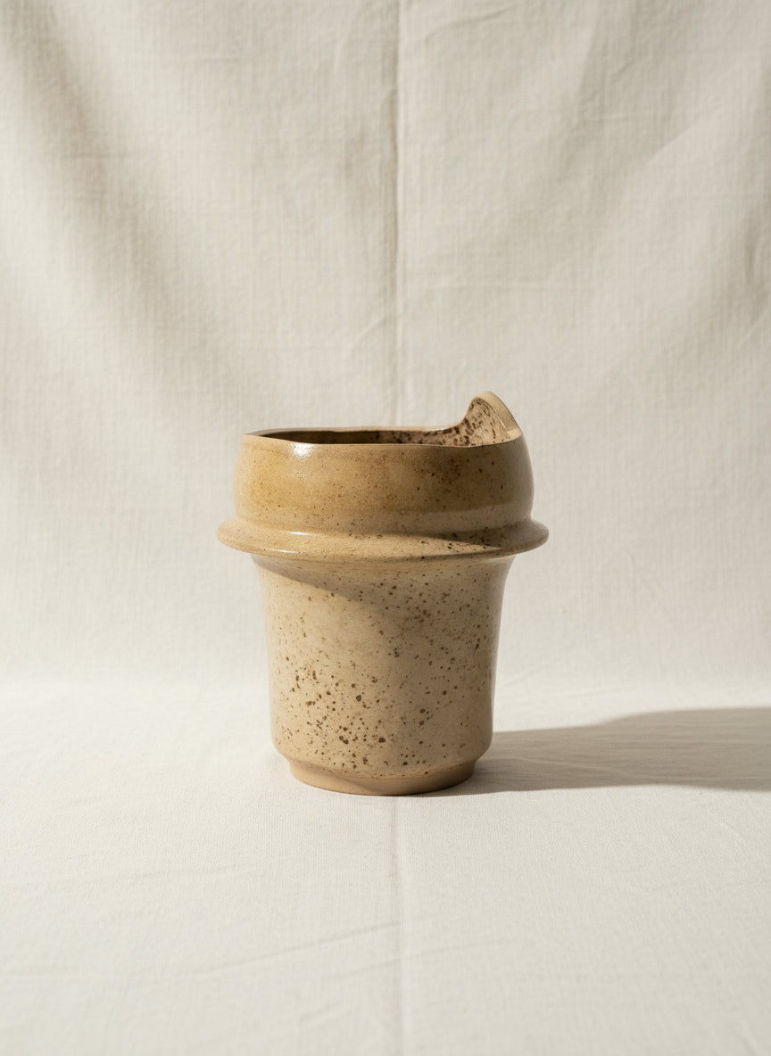 Quebec artisan stoneware pottery vase, signed and handcrafted in cream and brown speckled glaze, rustic yet elegant decor piece — Hommes and Gardens, Pots + Vessels Collection, Home Decor, Ceramic Art, Handcrafted Pottery, Vintage Vase, Artistic Interiors.