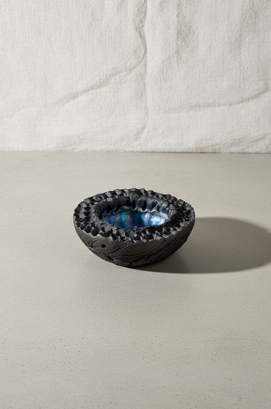 Raku Lava Bowl by Hutch Ceramics Maui, a 1960s vintage volcanic crater-inspired pottery piece featuring blue and black glaze with lava texture — Hommes and Gardens, Pots and Vessels Collection, Home Decor, Decorative Bowls, Art Pottery, Mid Century Modern, Raku Technique, Handmade Ceramic Art, Vintage Hawaii Pottery, Collectible Artisan Design.