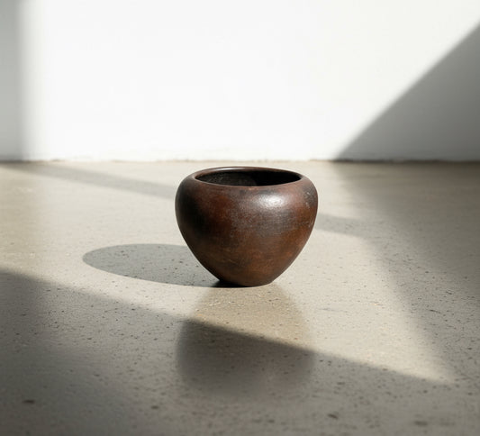 Small vintage dark brown clay vase with organic pebble shape and rich earthy texture, handcrafted pottery piece — Hommes and Gardens, Pots + Vessels Collection, Home Decor, Ceramic Pottery, Rustic Interiors, Handmade Decor, Artistic Vase.