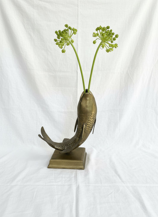 Solid brass fish vase with sculptural form and polished gold finish, luxurious statement piece for artistic interiors — Hommes and Gardens, Pots + Vessels Collection, Home Decor, Brass Vase, Decorative Object, Modern Luxury, Artistic Metalwork.
