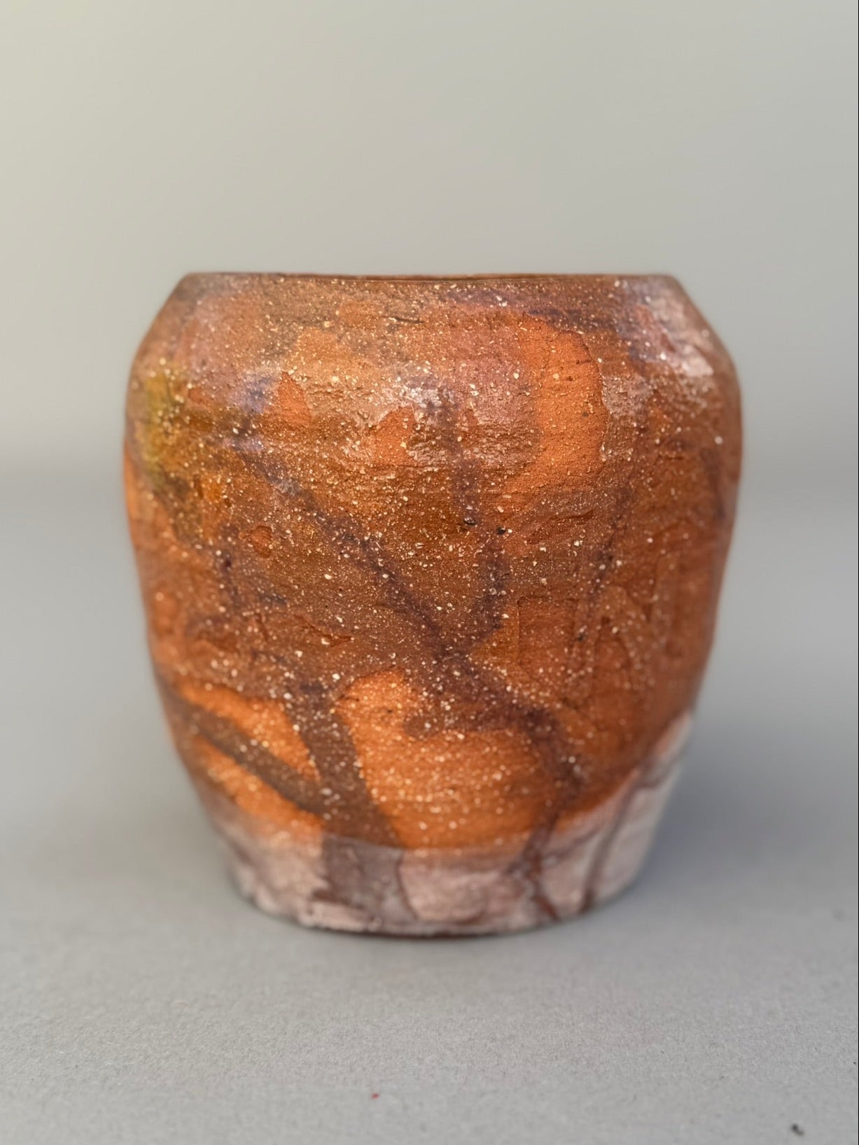 Detailed view of signed Buhrandt studio pottery cup highlighting abstract terracotta glaze and handcrafted stoneware surface — Hommes and Gardens, Home Decor Collection, landscape design, plant design, Landscape Architect, Interior Designer, Outdoor Living, Outdoor Decorations, Home Design, Luxury Design, Art, Furniture, Objects, Best Gifts, Nature, Backyard, Yard.