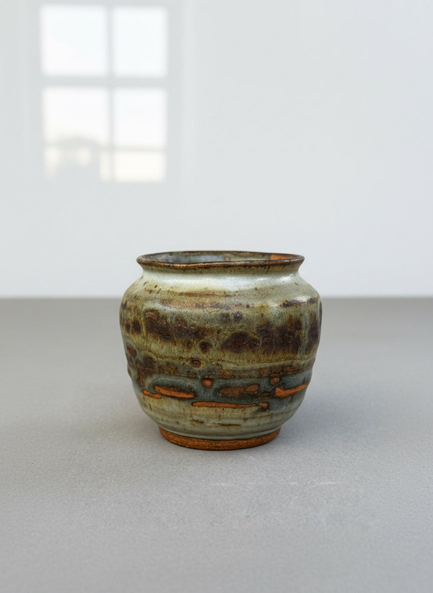 Hand-thrown studio pottery urn vase signed P.S.E. with layered brown, gray, and terracotta ash glaze, rounded stoneware form — Hommes and Gardens, Home Decor Collection, landscape design, plant design, Landscape Architect, Interior Designer, Outdoor Living, Outdoor Decorations, Home Design, Luxury Design, Art, Furniture, Objects, Best Gifts, Nature, Backyard, Yard.