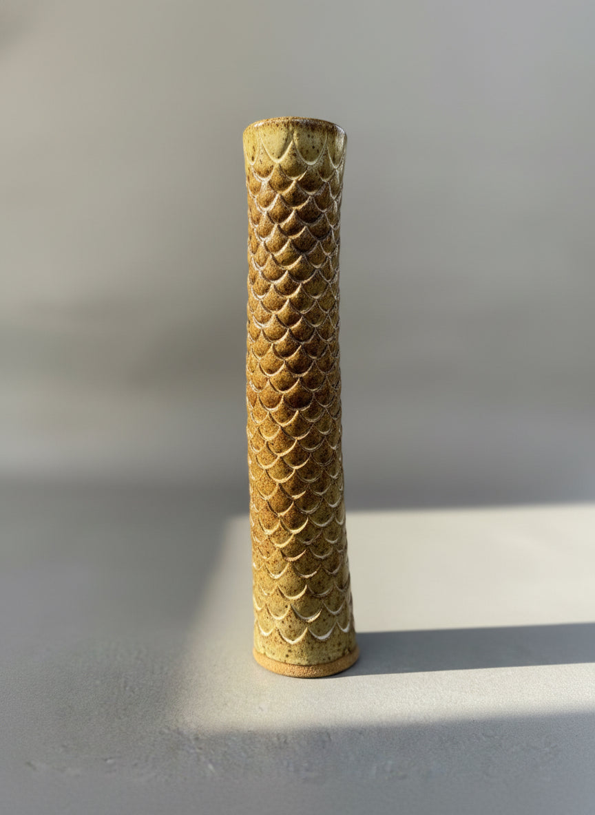 Tall hand-glazed ceramic vase with fish scale relief texture, signed A.G.E., featuring earthy mottled tones and cylindrical studio pottery design — Hommes and Gardens, Home Decor Collection, landscape design, plant design, Landscape Architect, Interior Designer, Outdoor Living, Outdoor Decorations, Home Design, Luxury Design, Art, Furniture, Objects, Best Gifts, Nature, Backyard, Yard.
