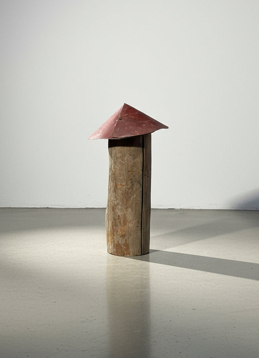 Tall log mushroom sculpture with a red metal cap, handcrafted from weathered wood and aged metal for rustic handmade folk art appeal — Hommes and Gardens, Home Decor Collection, landscape design, plant design, Landscape Architect, Interior Designer, Outdoor Living, Outdoor Decorations, Home Design, Luxury Design, Art, Furniture, Objects, Best Gifts, Nature, Backyard, Yard.