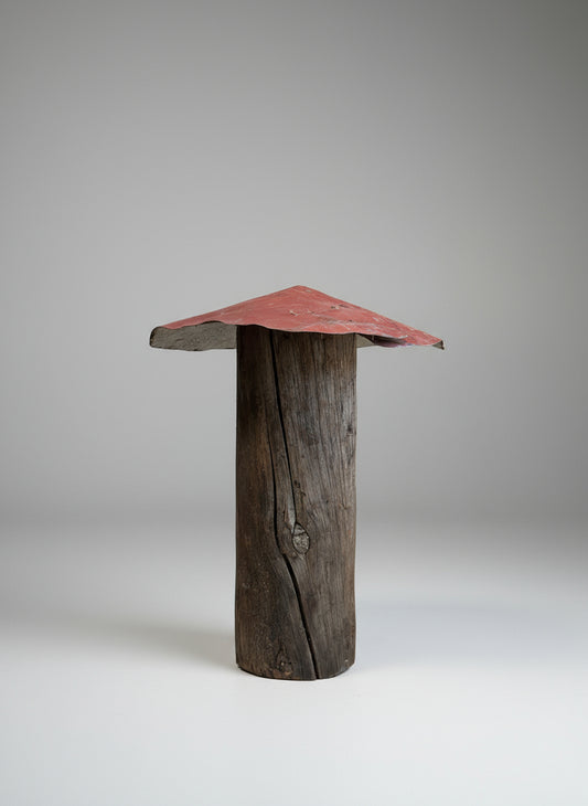 Tall mushroom sculpture made from a weathered wood post with a red metal roof, showcasing rustic primitive folk art craftsmanship and reclaimed materials — Hommes and Gardens, Home Decor Collection, landscape design, plant design, Landscape Architect, Interior Designer, Outdoor Living, Outdoor Decorations, Home Design, Luxury Design, Art, Furniture, Objects, Best Gifts, Nature, Backyard, Yard.
