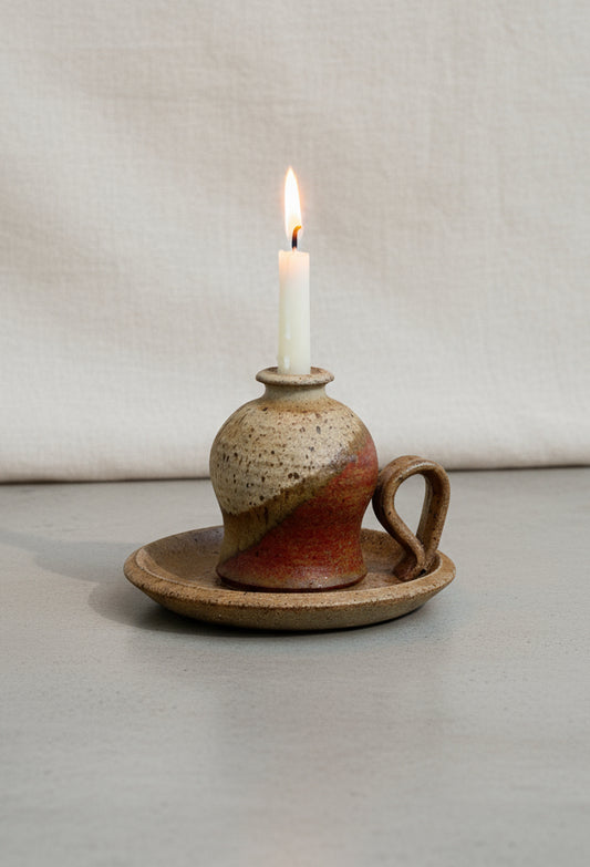 Vintage chamber stick candle holder crafted in glazed brown and beige stoneware, a timeless ceramic piece adding rustic warmth to any space — Hommes and Gardens, Home Decor Collection, Candles, Candle Holders, Vintage Pottery, Ceramic Decor, Rustic Home Accessories, Handmade Lighting Accent.