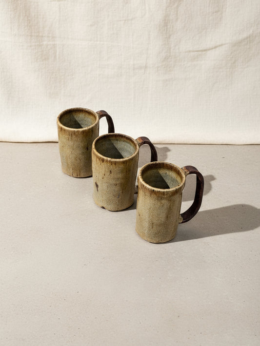 Vintage earth tone ceramic mug set of three, handcrafted with natural hues and rustic charm, perfect for coffee or tea lovers — Hommes and Gardens, Home Decor Collection, Mugs, Vintage Drinkware, Ceramic Pottery, Rustic Kitchenware, Handmade Tableware, Earthy Home Accessories.