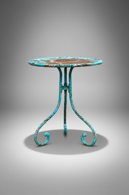 Vintage French turquoise bistro table with elegant rusted patina and forged iron base, a charming outdoor accent for gardens or patios — Hommes and Gardens, Furniture Collection, Dining Tables, Outdoor Tables, Vintage French Decor, Patina Finish, Bistro Style, Garden Furniture, Rustic Accent Table.
