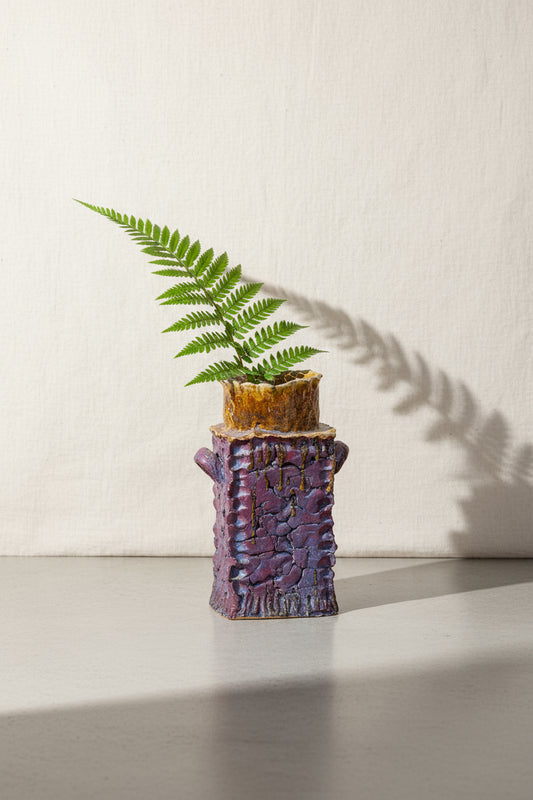 Vintage handmade signed ceramic vase with a purple body and mustard-colored top, tall square-shaped pottery piece with bold design — Hommes and Gardens, Pots + Vessels Collection, Vases, Vintage Pottery, Artistic Decor, Handcrafted Ceramic Art, Unique Home Accessories, Modern Interior Style.