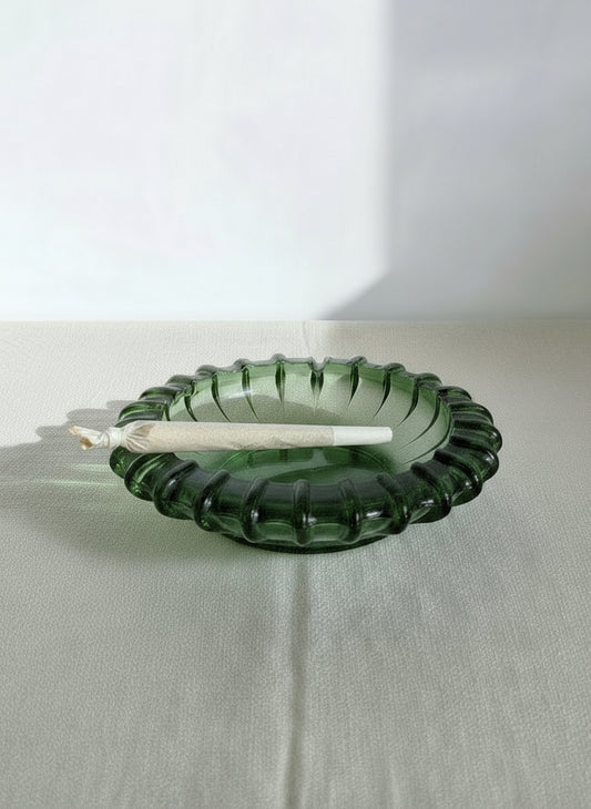 Vintage mid-century green glass ashtray from the 1960s featuring a bold sunburst pattern and pressed glass design, perfect as a retro decor accent — Hommes and Gardens, Home Decor Collection, Ashtrays, Decorative Objects, Mid Century Modern, Vintage Glassware, Green Glass Decor, Retro Table Accessory, Collectible Home Accent.
