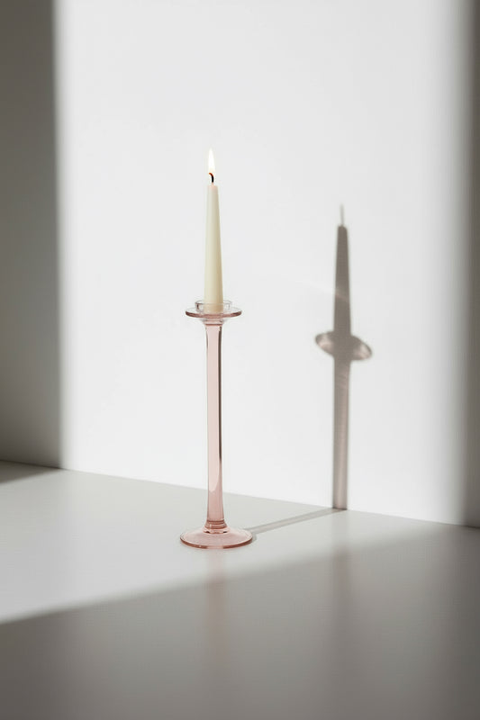 Vintage pink glass candle holder with elegant tall design and soft rosy hue, a timeless accent piece adding warmth and charm to any interior — Hommes and Gardens, Candles Collection, Home Decor, Candle Holders, Vintage Glass Decor, Pink Candle Stand, Romantic Home Accent, Classic Lighting Accessory.
