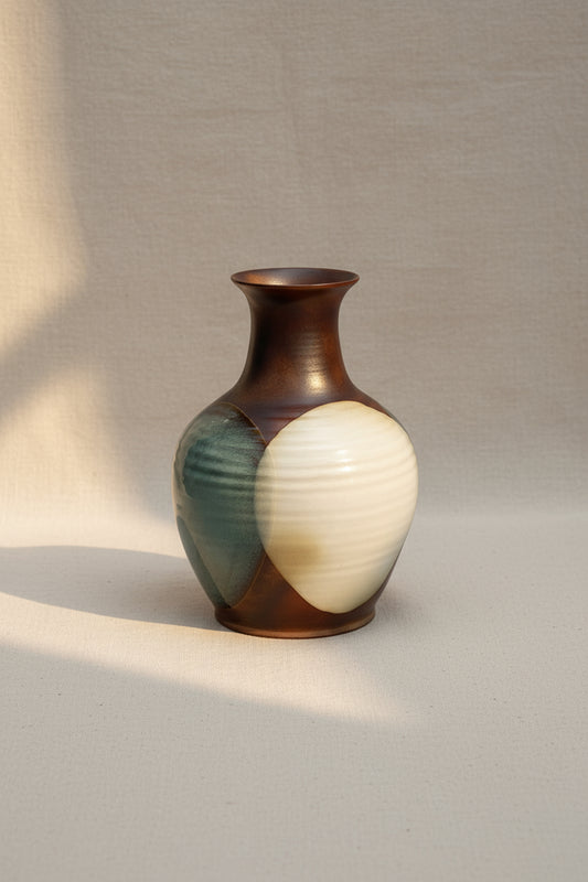 Vintage Pottery Craft ceramic drip glaze vase featuring abstract circular patterns in brown, antique white, and blue tones, a mid-century modern art piece — Hommes and Gardens, Pots and Vessels Collection, Vases, Art Pottery, Decorative Objects, Vintage Ceramic, Mid Century Modern, Drip Glaze Design, Collectible Home Accent.