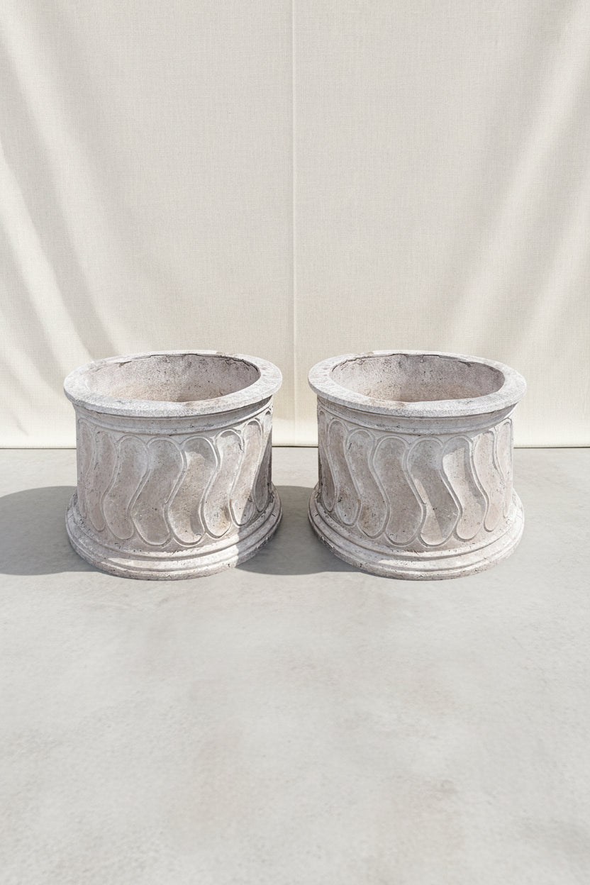 Set of two vintage round Roman style swirl planters featuring elegant classical patterns and weathered stone texture, perfect for timeless garden design — Hommes and Gardens, Pots and Vessels Collection, Planters, Garden Decor, Outdoor Living, Vintage Stonework, Classical Design, Architectural Garden Accent, Outdoor Planter Set.