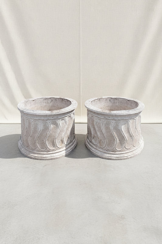 Set of two vintage round Roman style swirl planters featuring elegant classical patterns and weathered stone texture, perfect for timeless garden design — Hommes and Gardens, Pots and Vessels Collection, Planters, Garden Decor, Outdoor Living, Vintage Stonework, Classical Design, Architectural Garden Accent, Outdoor Planter Set.