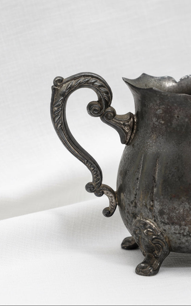 Vintage silver plated creamer pitcher from Hong Kong with footed base and elegant spout, perfect for refined interiors — Hommes and Gardens, Home Decor Collection, Silver Decor, Decorative Tableware, Luxury Accent, Vintage Metalware, Classic Styling.